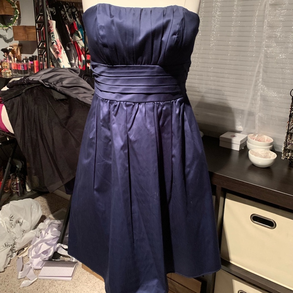 Navy strapless cotton dress with pockets.